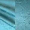 Teal green textured tablecloth.