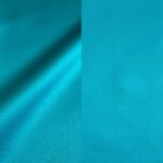 Vibrant turqouise satin tablecloths and runners.