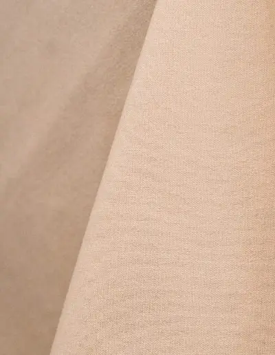Beige cotton tablecloth and dinner napkin.
