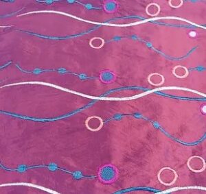 Purple, teal, silver, and raspberry taffeta wave and circle print tablecloth and runner.