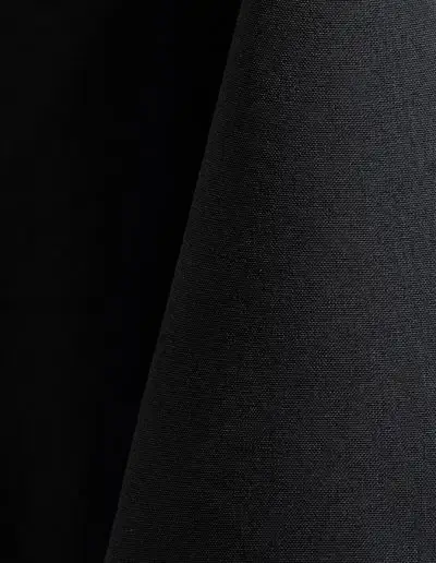 Black polyester tablecloth, runner, sash, and dinner napkin.
