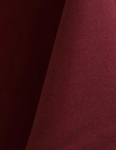 Burgundy polyester tablecloth, runner, sash, and dinner napkin.