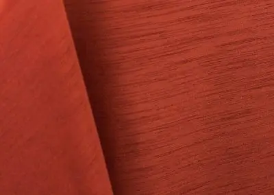 Burnt orange majestic dupioni tablecloth, runner, sash, and dinner napkin.