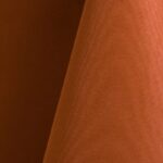 Burnt orange polyester tablecloth, runner, sash, and dinner napkin.