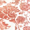 Coral watercolor-style floral print tablecloth.