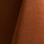 Copper polyester tablecloth, runner, sash, and dinner napkin.