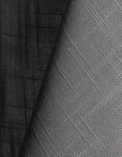 Light grey textured dinner napkin.