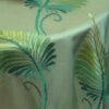 Teal and lime green feather print sheer tablecloth and runner.