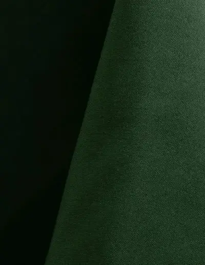 Forest green polyester tablecloth, runner, sash, and dinner napkin.