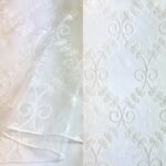 White sheer embroidered tablecloth and runner.