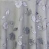 Sheer grey dimensional floral print tablecloth.