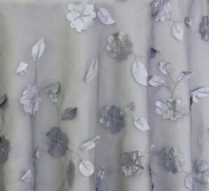 Sheer grey dimensional floral print tablecloth.