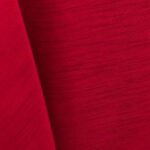 Bright red majestic dupioni tablecloth, runner, sash, and dinner napkin.