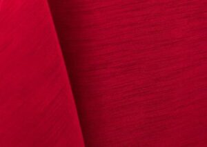 Bright red majestic dupioni tablecloth, runner, sash, and dinner napkin.