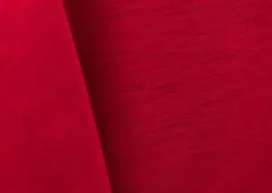 Bright red majestic dupioni tablecloth, runner, sash, and dinner napkin.