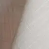 Ivory textured dinner napkin.