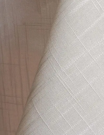 Ivory textured dinner napkin.