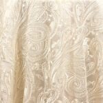 Sheer ivory paisley lace tablecloth and runner.