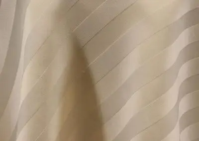 Ivory satin stripe tablecloth.