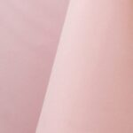 Light pink polyester tablecloth, runner, sash, and dinner napkin.