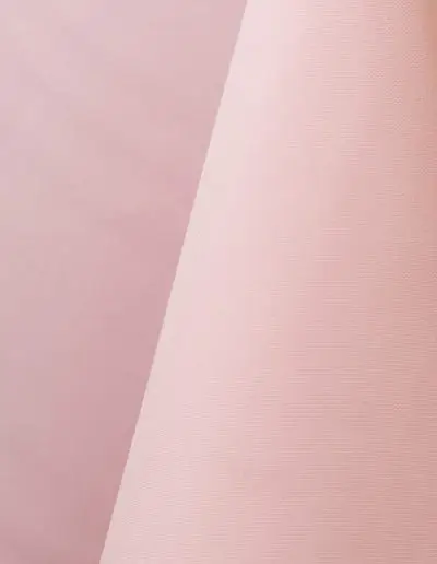 Light pink polyester tablecloth, runner, sash, and dinner napkin.