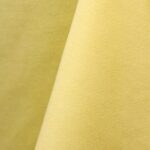 Pale yellow cotton tablecloth and dinner napkin.