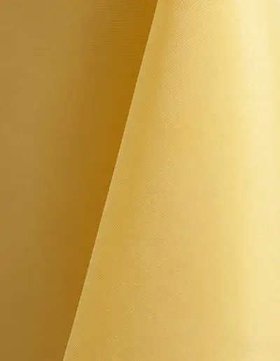 Pale yellow polyester tablecloth, runner, sash, and dinner napkin.