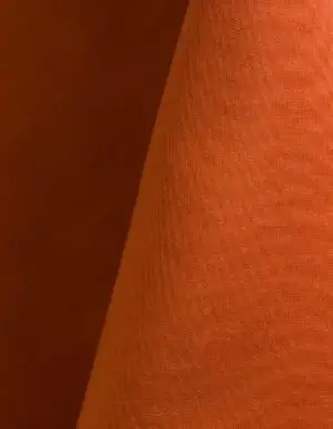 Orange polyester tablecloth, runner, sash, and dinner napkin.