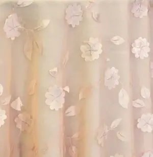 Peach dimensional floral print tablecloth.