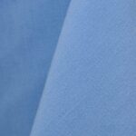 Periwinkle blue cotton tablecloth and dinner napkin.