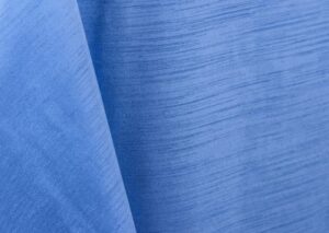 Periwinkle blue majestic dupioni tablecloth, runner, sash, and dinner napkin.