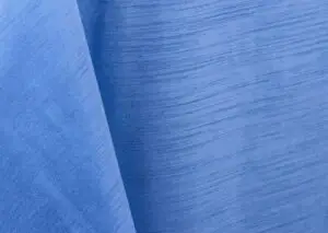 Periwinkle blue majestic dupioni tablecloth, runner, sash, and dinner napkin.