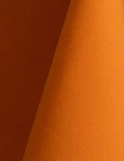 Orange cotton tablecloth and dinner napkin.