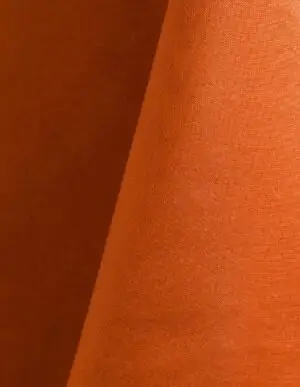 Bright orange polyester tablecloth, runner, sash, and dinner napkin.