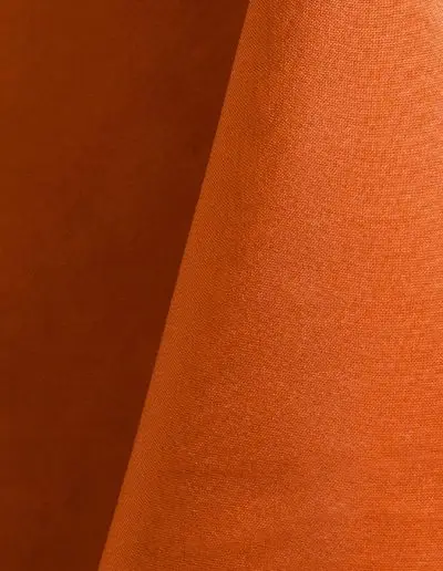 Bright orange polyester tablecloth, runner, sash, and dinner napkin.