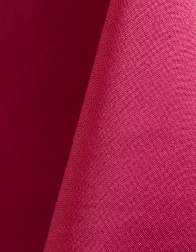 Raspberry polyester tablecloth, runner, sash, and dinner napkin.