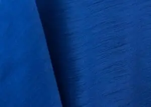 Royal blue majestic dupioni tablecloth, runner, sash, and dinner napkin.