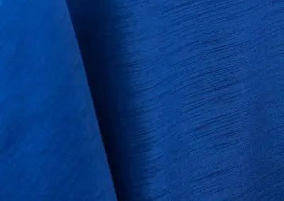 Royal blue majestic dupioni tablecloth, runner, sash, and dinner napkin.