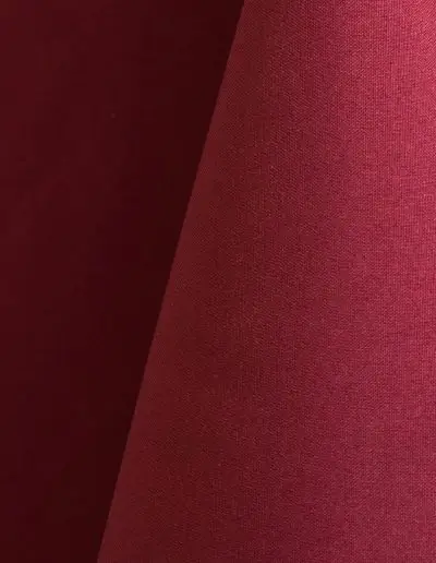 Ruby red polyester tablecloth, runner, sash, and dinner napkin.