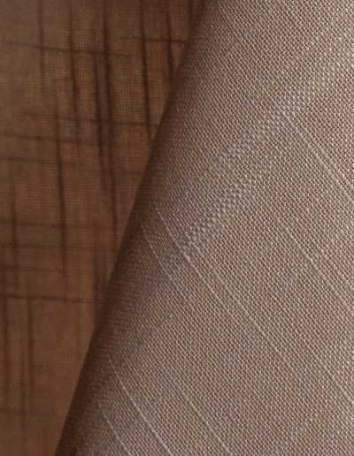 Tan textured dinner napkin.