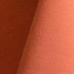 Pale orange cotton tablecloth and dinner napkin.