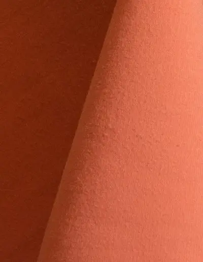 Pale orange cotton tablecloth and dinner napkin.