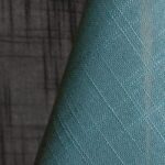 Seafoam blue textured dinner napkin.