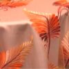 Red, yellow, and orange feather print sheer tablecloth and runner.