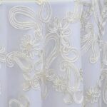 Ivory dimensional paisley lace tablecloth.