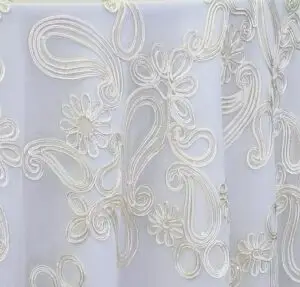 Ivory dimensional paisley lace tablecloth.