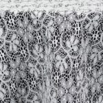 Traditional white lace tablecloth and runner.