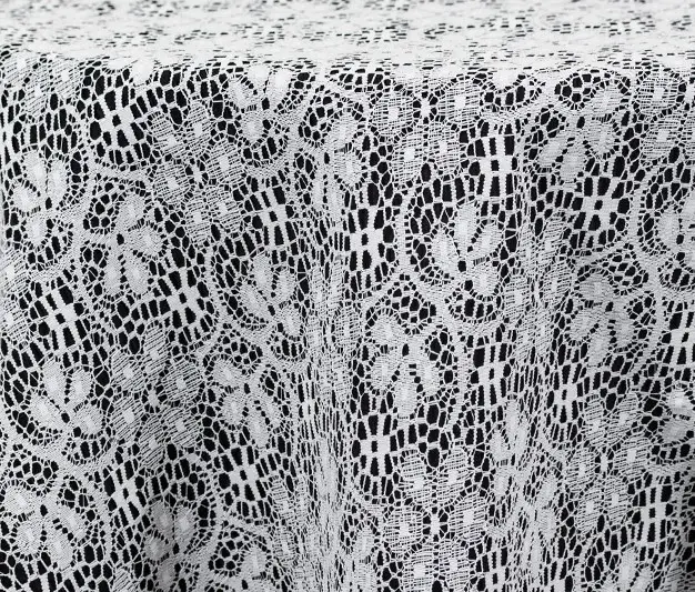 Traditional white lace tablecloth and runner.