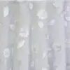 White dimensional floral print tablecloth.