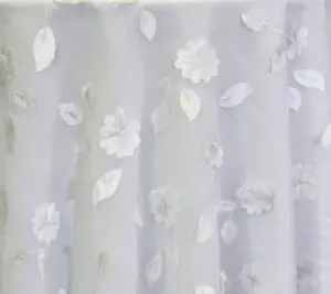 White dimensional floral print tablecloth.